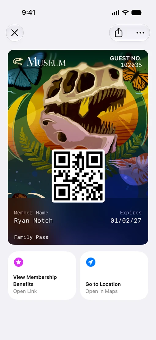 A museum membership pass open in Apple Wallet on iPhone, with two Featured Action tiles beneath the card face reading View Membership Benefits and Go to Location.
